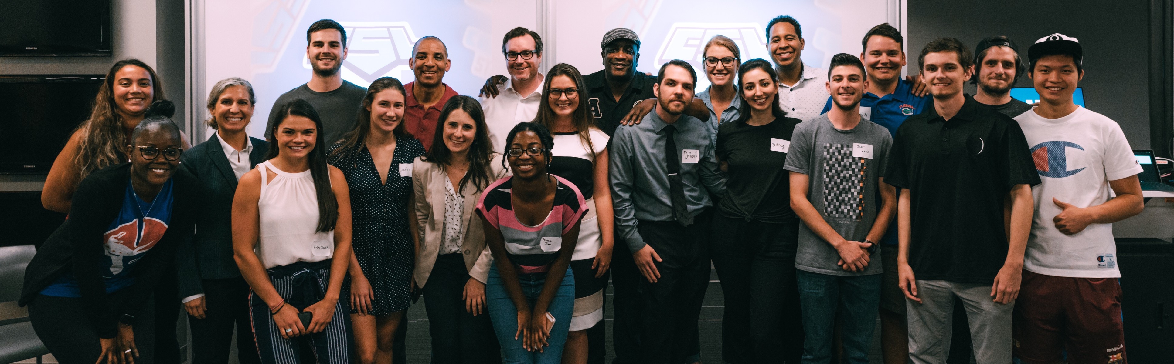 Esports masterclass participants, judges pose for group photo.