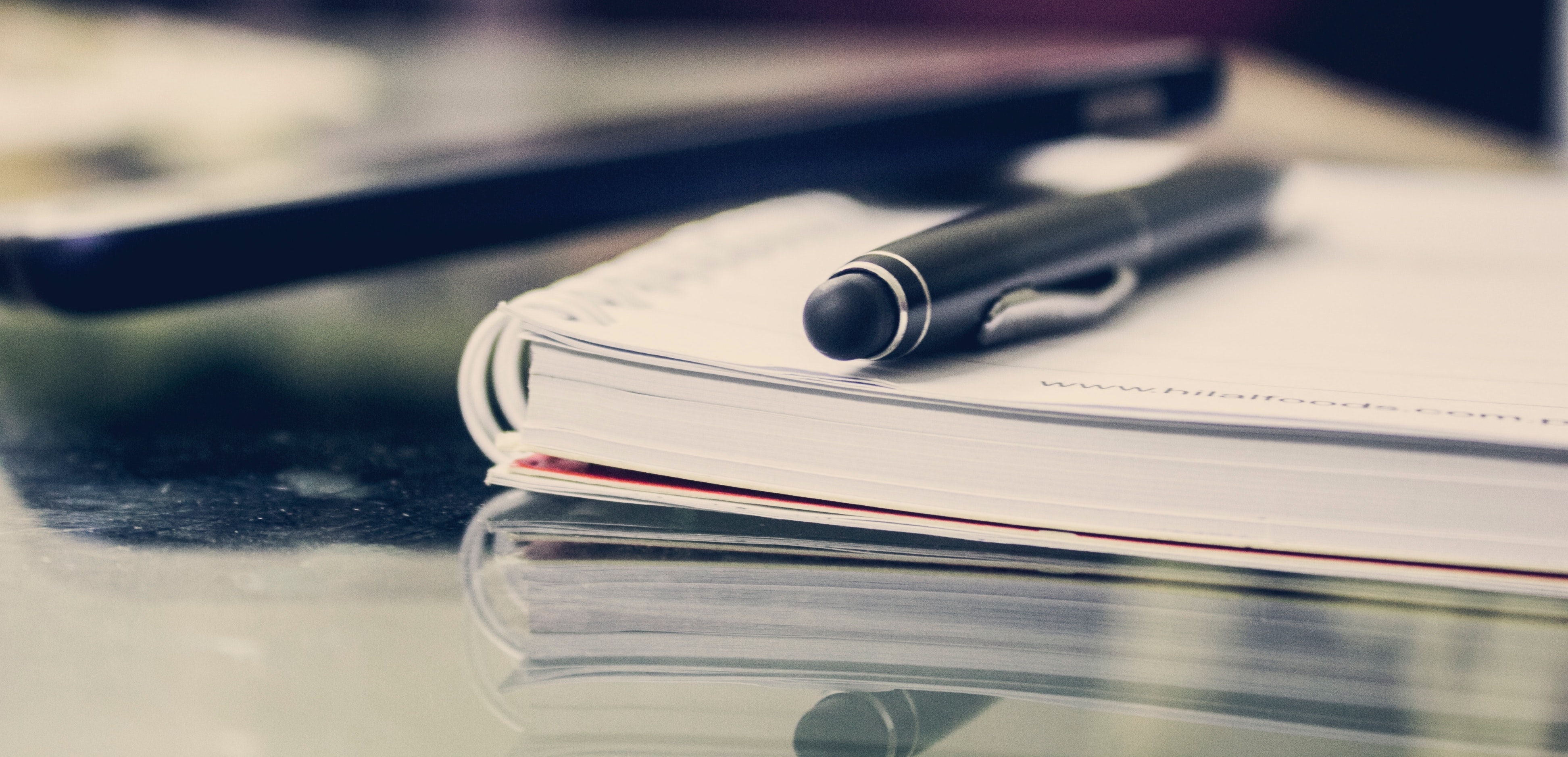 Photo of  notebooks on a desk