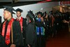 Smiles and waves - Students filing into the Hofheinz Pavilion