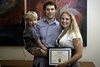  Amber Groll poses with her family