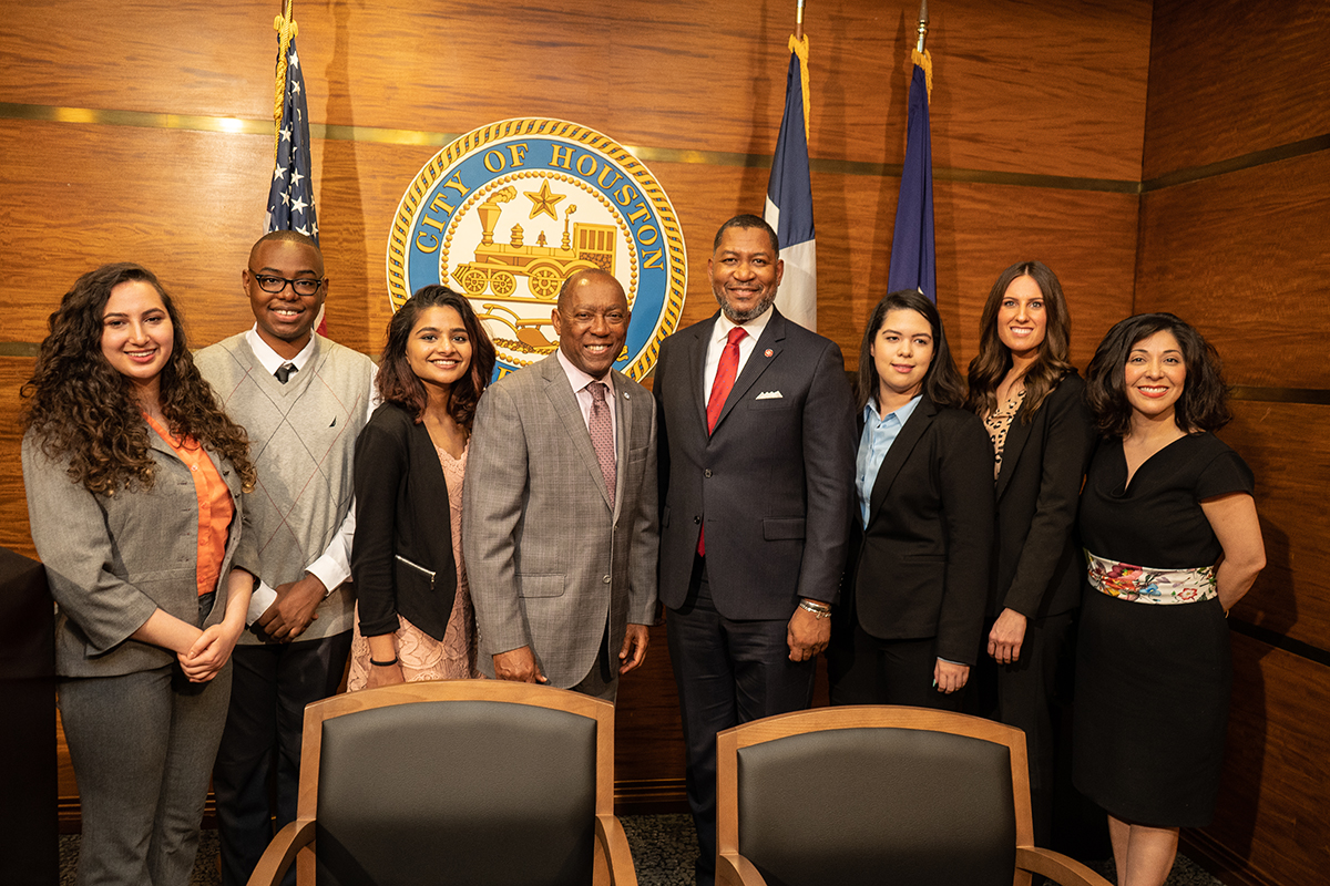 Houston Mayor Sylvester Turner, Dean Tillis, student interns Samantha Annab, London Douglas, Anu Thomas, Jessica Ortega, Brittney Wallace, and Juliet Stipeche, director of education for the City of Houston.