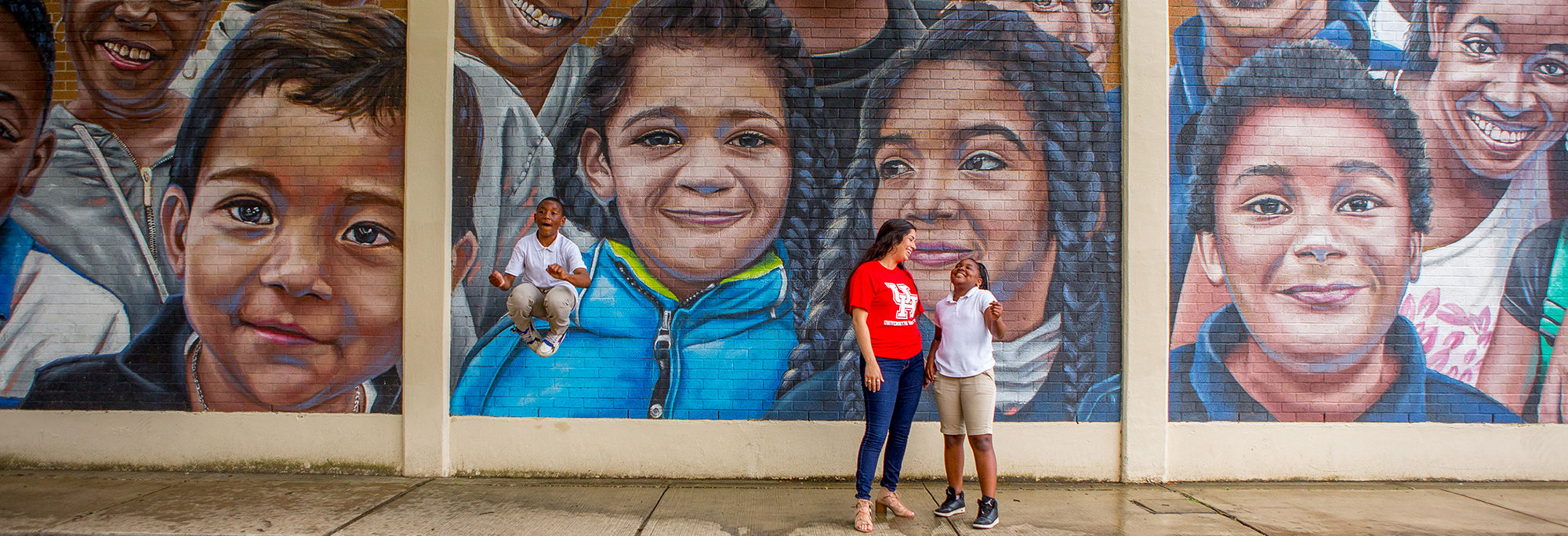 Blackshear Elementary Mural: Teacher and two students in front