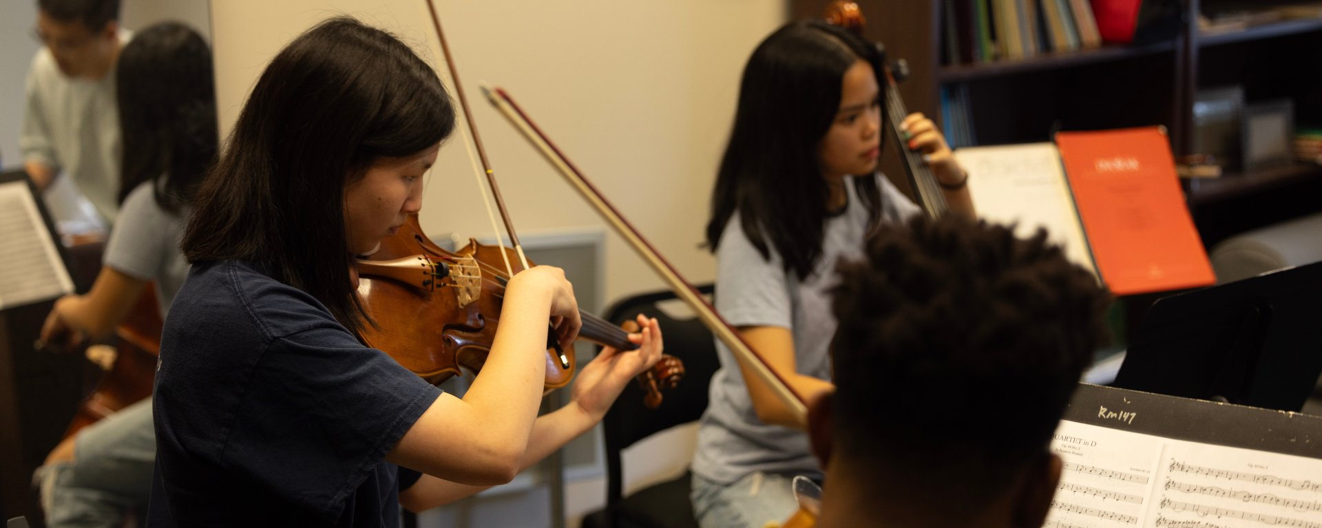 A string quartet rehearsing with Dr. Eunghee Cho