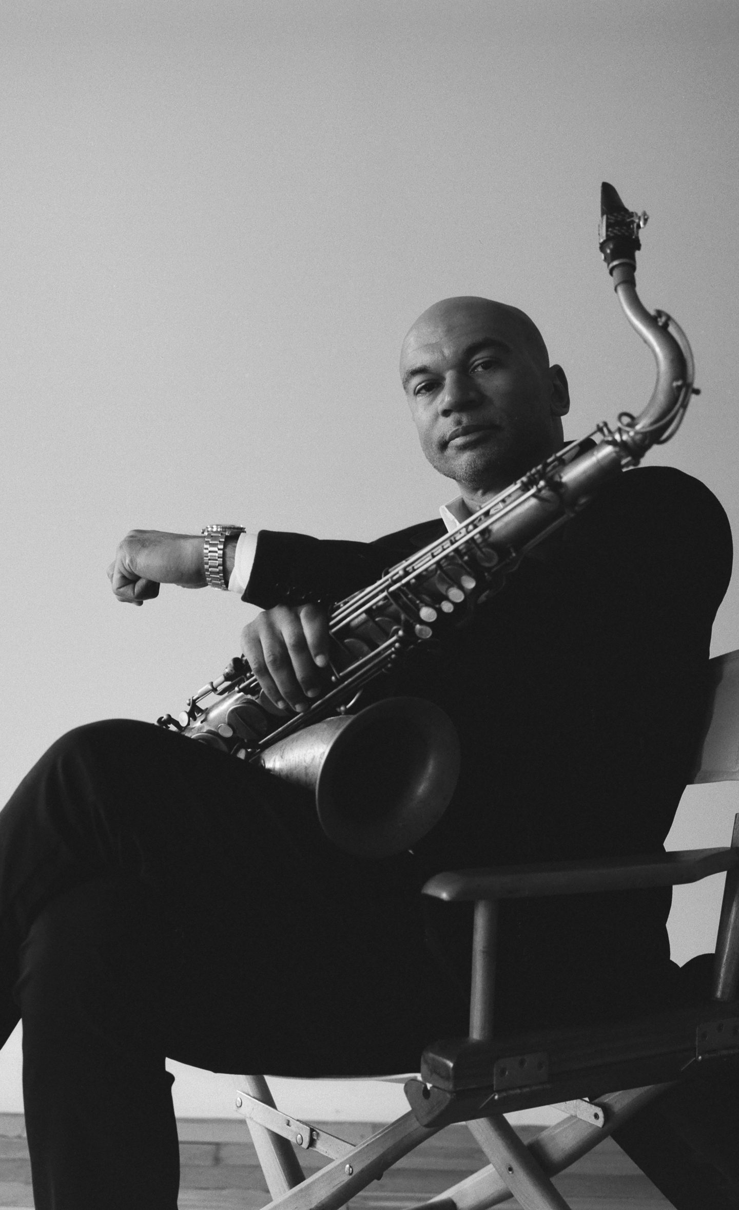 Black & white photo of Walter Smith III holding his saxophone