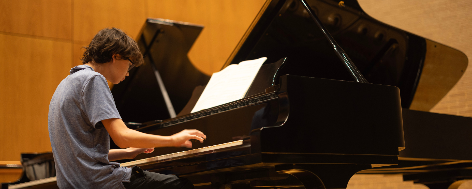 A young pianist performing in Dudley Recital Hall