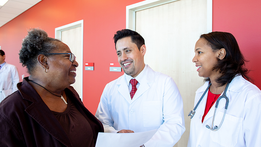 Doctors smiling with patient