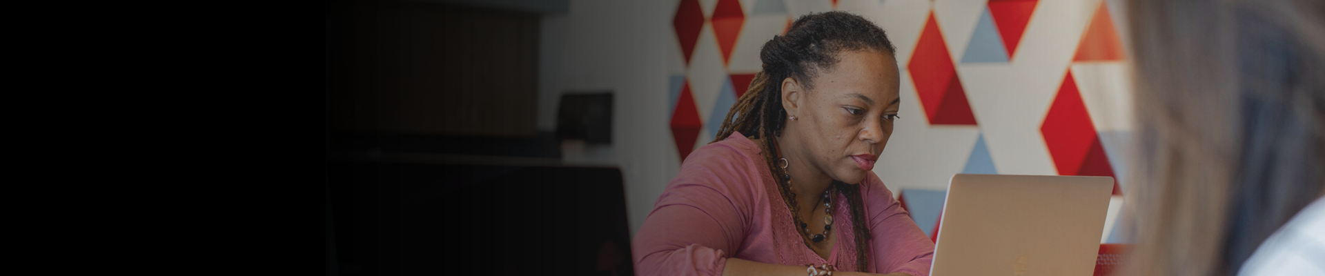 Woman sitting at a laptop