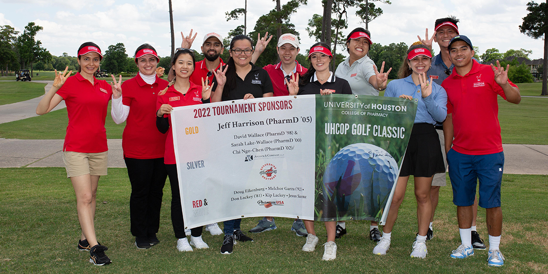 Students with sponsor banner