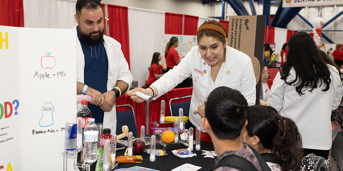 Students display amount of sugar in common drinks.