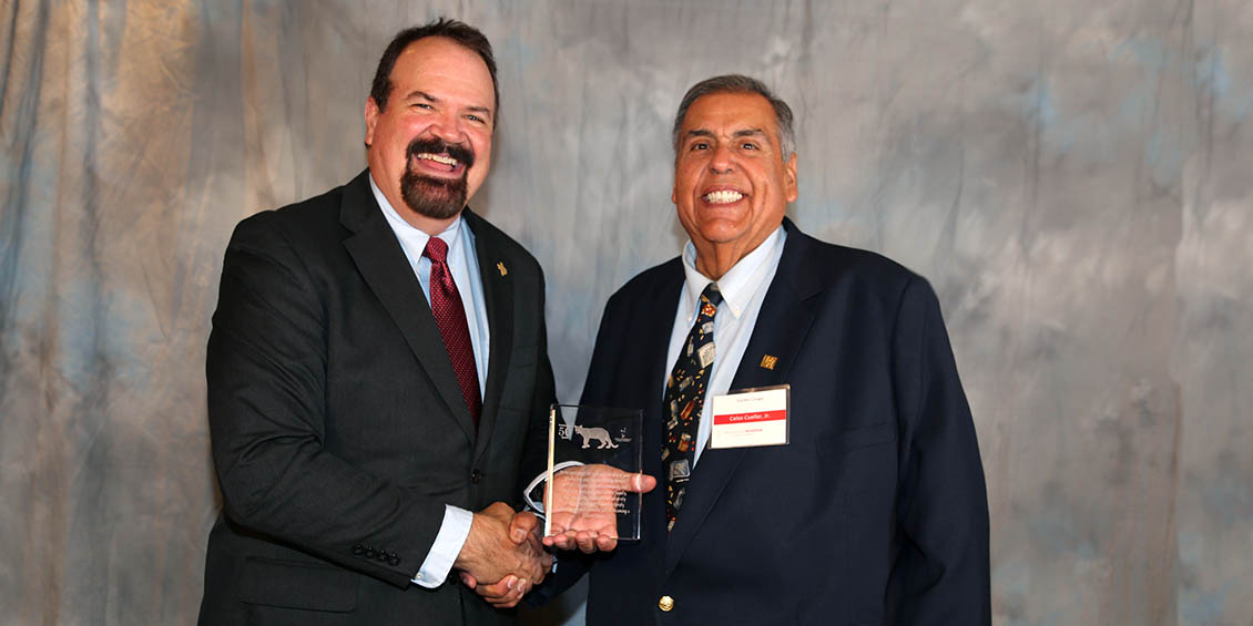 uhcop dean lamar pritchard and cuellar holding commemorative 50th anniversary plaque