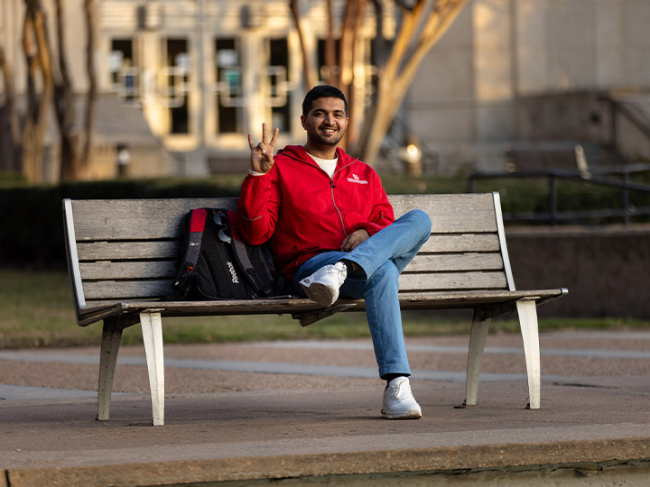 Student sitting on bench