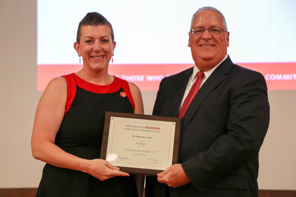 Eve Esch accepting Ambassador Award from Dr. Richard Walker