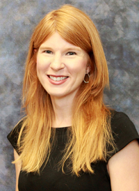 Portrait of a red-haired woman smiling