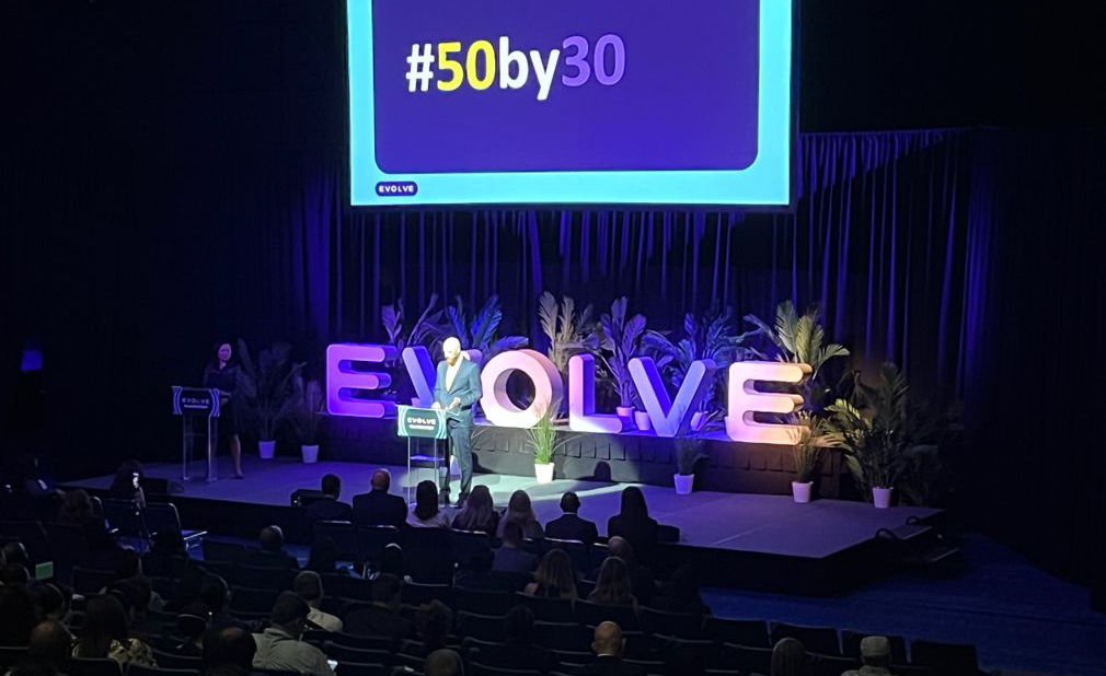 Speaker on stage at Evolve Houston